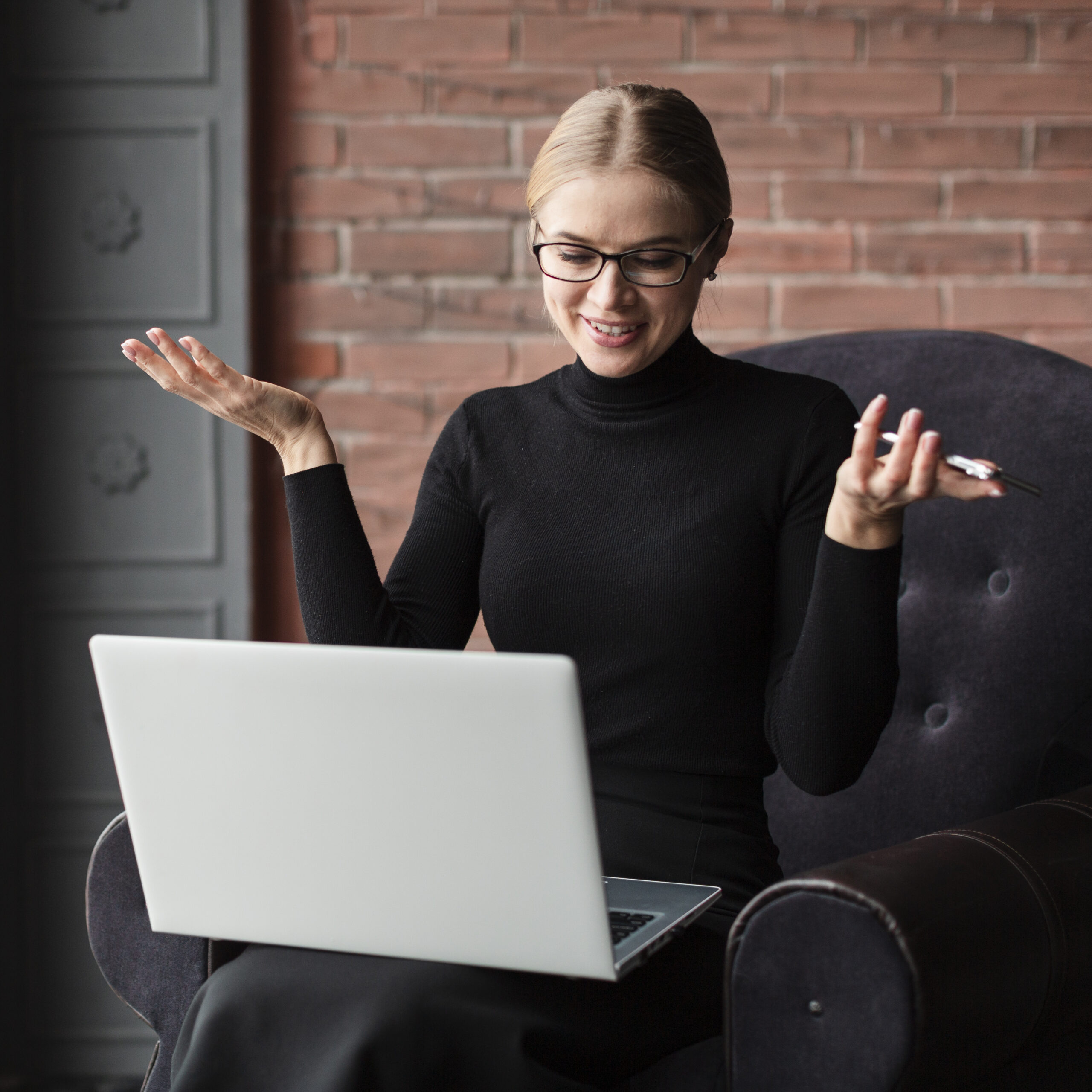 woman-with-laptop-phone-couch